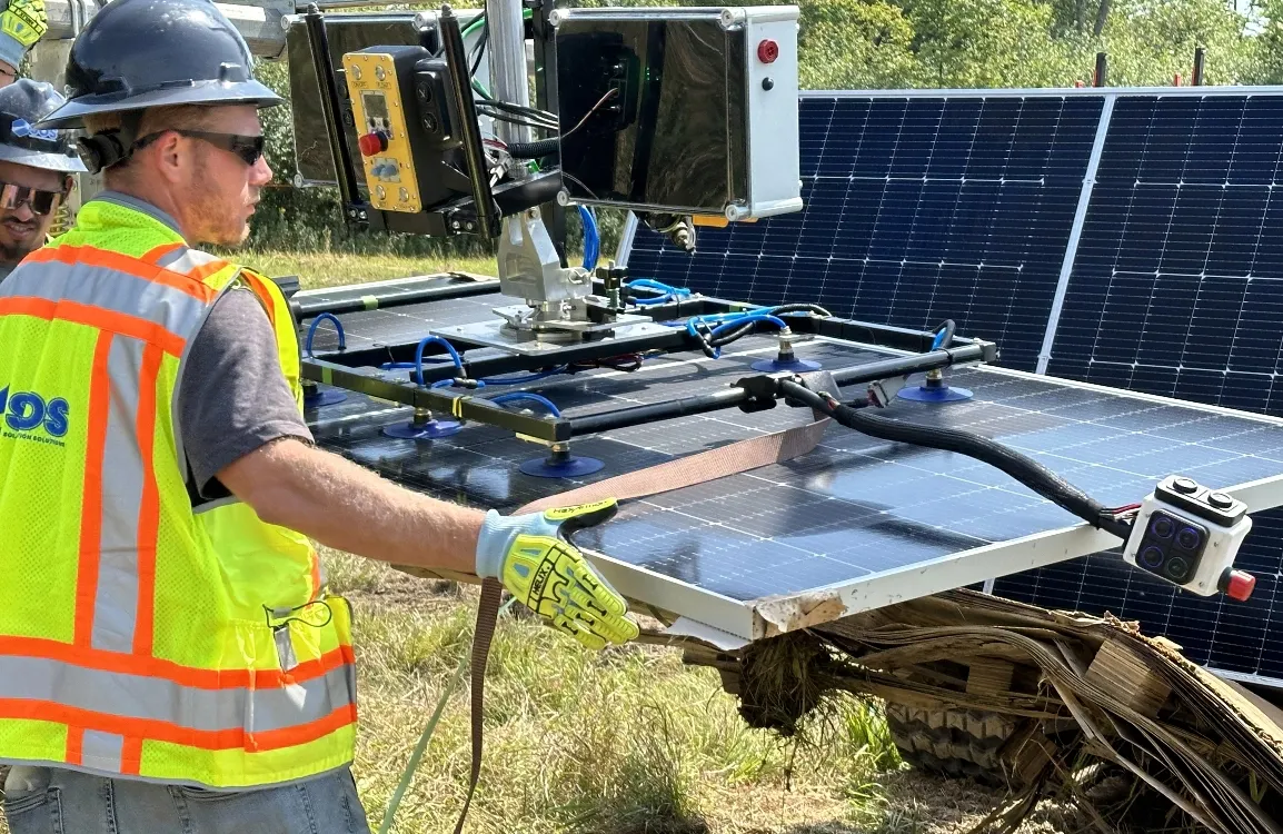 Specialized Vacuum Gripper Assembly Worker moving solar panel with CrewMate